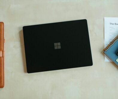 Website cost in Perth concept with a laptop and calculator on a desk